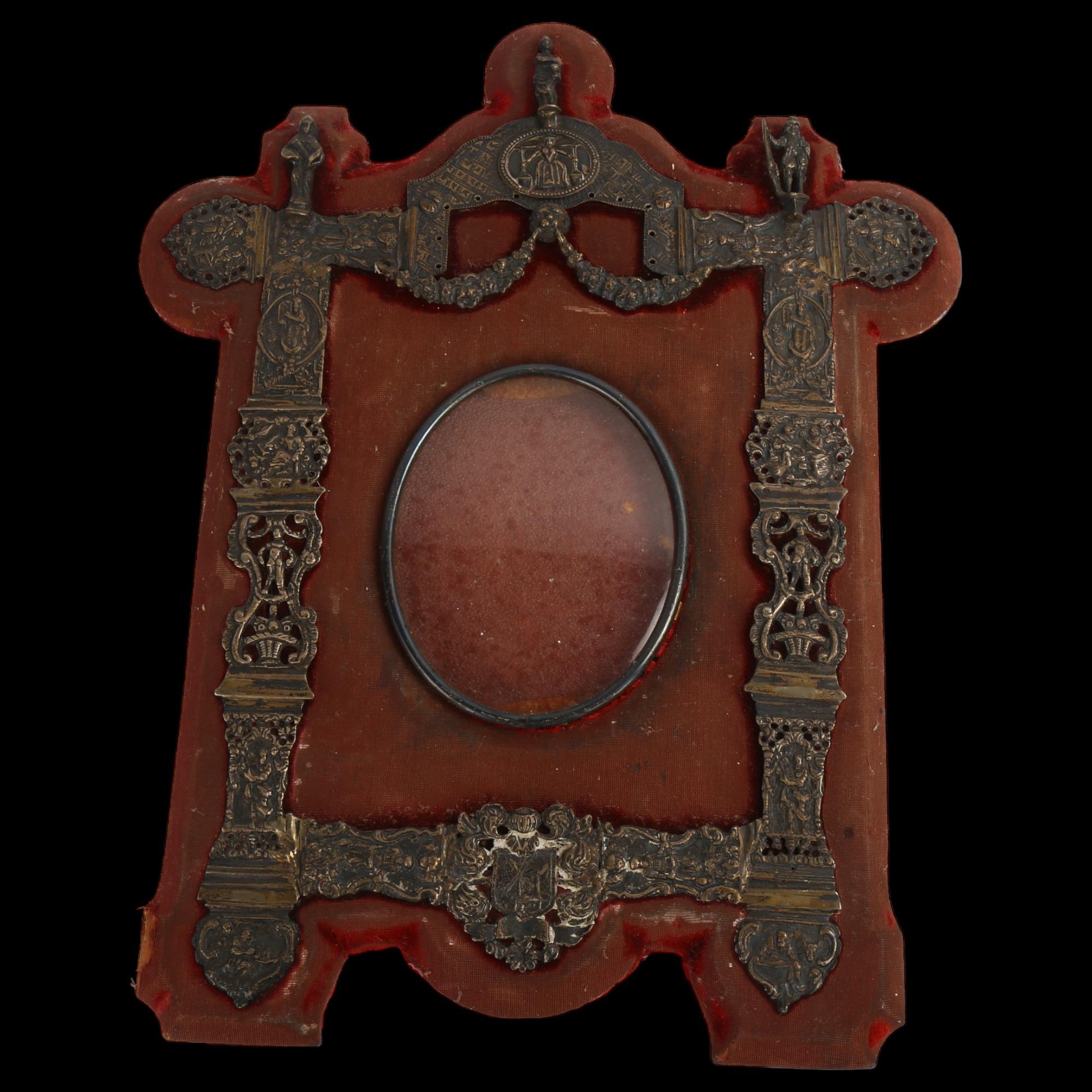 An early 20th century Dutch? silver-fronted photo frame, with relief embossed and pierced swag and