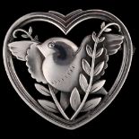 GEORG JENSEN - a Danish stylised sterling silver heart bird brooch, designed by Arno Malinowski,