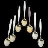 A set of 7 Norwegian vermeil sterling silver and harlequin enamel coffee spoons, maker's marks JT,