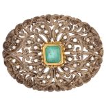 An emerald and diamond oval bombe brooch, unmarked gold and silver settings with central emerald