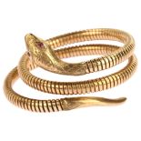 A mid-20th century 9ct gold ruby figural coiled snake bangle, with engraved head and gas-pipe