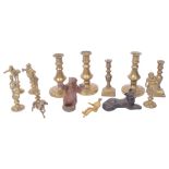 A group of miniature brass candlesticks, painted lead bear etc