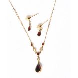 A delicate 9ct gold seed pearl and red stone set drop pendant necklace and chain, together with a
