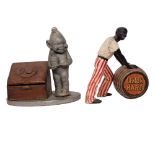 An early 20th century painted wood Chairman Tobacco imp, H23cm, and a Vintage Lemon Hart rum-back...