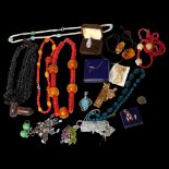 A group of costume jewellery, to include a silver stone set heart-shaped brooch, a coral necklace, a