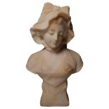 A small marble bust of a young lady in a bonnet, H36cm, indistinctly signed to the back