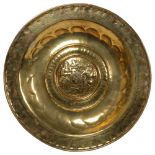 A 16th century Nuremburg brass arms dish, diameter 58cm Good overall condition, some surface