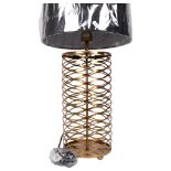 A contemporary table lamp and shade, with a pierced open latticework body, overall height 73cm