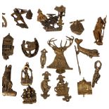 A large quantity of brass door knockers, including a Dartmoor Pisky, the Norseman etc