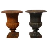 A pair of small cast-iron Campana design urns, W18cm, H23cm Both urns have a 9cm break in the tongue