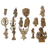 A group of Vintage brass door knockers, including a ring-handled lion mask, a Cornish pisky, eagle