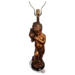 A heavy composition table lamp, modelled as a gilded cherub holding a shell, height to top of head