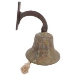 Antique ship's bell with fixing bracket "Girl Pat", height of bell 16cm, diameter 9.7cm.