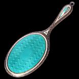 A small silver plated and turquoise enamelled doll's hand mirror, L8.5cm There is a small section of