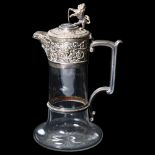 A glass Claret jug, with embossed silver plated mounts and heraldic lion knop, H28cm