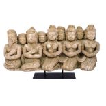 An Oriental composite frieze, depicting 9 kneeling figures, W42cm