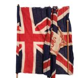 A group of 3 Union Jacks, mounted on hand-held rods, 80 x 58cm approx, and a small British