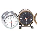 A brass-cased clock on feet with quartz movement, and 2 dials, H20cm, and a chrome-cased bulkhead