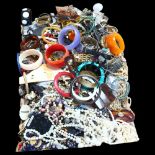 A large quantity of mixed costume jewellery, pearl necklaces, bangles, wristwatches etc