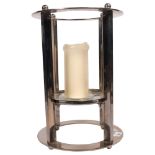A modernist polished steel candle stand, H41cm overall