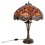 A Tiffany style twin-light table lamp on composition base, with multi-coloured dragonfly design