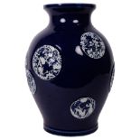 A Japanese blue glazed baluster vase, with applied decoration, Horal "Mon", with character mark to