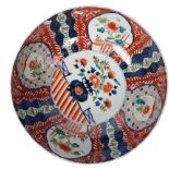 A large Oriental Imari decorated bowl, diameter 44.5cm, height 17cm There are a couple of hairline