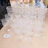 A set of 12 engraved Stuart Crystal wine glasses, H12.5cm, and a set of 10 matching Sherry glasses