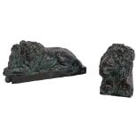 A pair of patinated plaster recumbent lions, L33cm, H15cm There are visible surface chips and