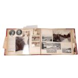 An album of newspaper cuttings, ephemera, photographs of various subjects, including a motorcar race