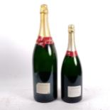 An empty Bollinger magnum Champagne bottle, and another