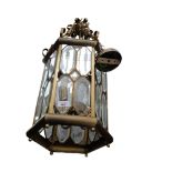 A modern brass and glazed hanging lantern, drop approx 120cm Lantern is in generally good condition,