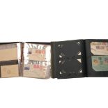 An album of mainly 1939 Australian stamped envelopes, and a partial album of world stamped envelopes