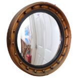 A convex giltwood circular wall-mounted mirror, diameter 52cm