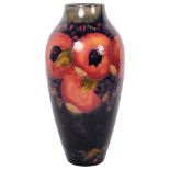 MOORCROFT - a large Pomegranate decorated baluster vase, with incised mark and green signature to