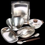 A collection of Danish and German stainless steel serving trays, fruit bowl and servers