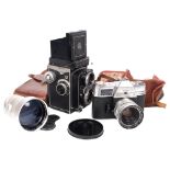 A Yashica 635 medium format TLR camera, serial no. 3890399, and a Kodak Retina Reflex IV, with