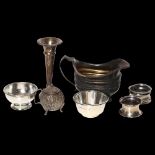 A group of silver items, to include 2 napkin rings, a sauce boat, 2 small dishes, 4.2oz, a small
