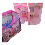 BARBIE - a boxed Barbie folding pretty house, in original box with some associated accessories