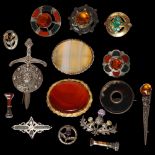 A silver and hardstone set Scottish design brooch, a similar smaller brooch, a silver dirk design