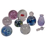 A group of 7 glass paperweights, including Murano and Langham, and a scent flask