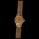 OMEGA - a lady's Omega 9ct gold cased mechanical wristwatch, with a gold plated woven strap Dial