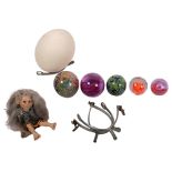 A group of interesting items, to include an ostrich egg shell, a selection of glass paperweights,