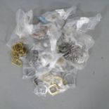 An assortment of brass and steel buckles, including strap, D, belt and ring buckles etc. From the
