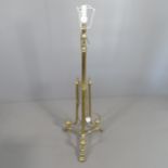 A telescopic brass Corinthian style standard lamp on tripod stand. H (tallest - 179cm). With shade.