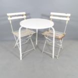 A painted metal circular-top garden table, 60x70cm and a pair of folding bistro chairs.