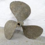 A patinated brass three blade propeller. Approximate diameter 49cm.