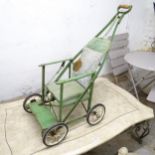 A mid-century Tuk-A-Way baby stroller.