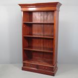 A tall mahogany open bookcase, with three adjustable shelves and drawers to base. 117x201x50cm.