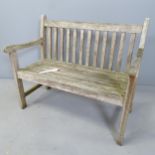 A small weathered teak slatted garden bench. 73x61x40cm. This is a child-size item, not a full